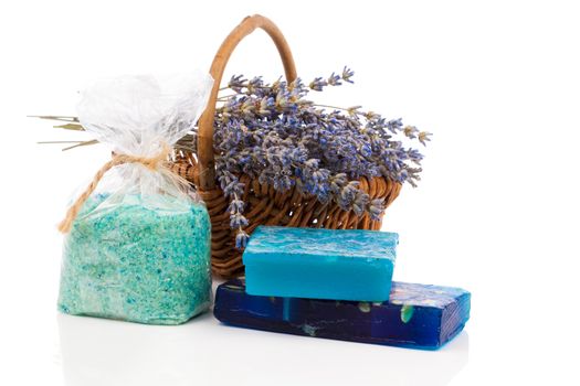 Spa still life with handmade soaps, lavender flowers and bath salt, on white background