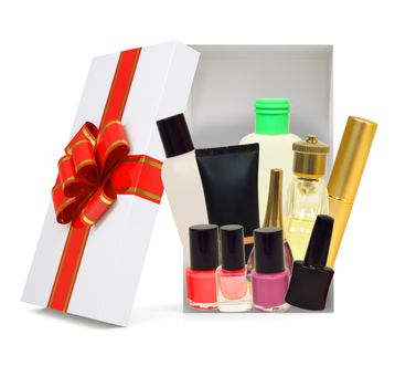 Open gift box with ribbon and cosmetics on isolated white background