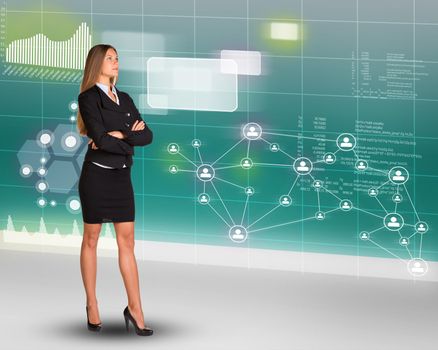 Businesswoman looking up on abstract background with graphs