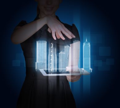 Businesswoman with tablet and 3d city model on abstract blue background