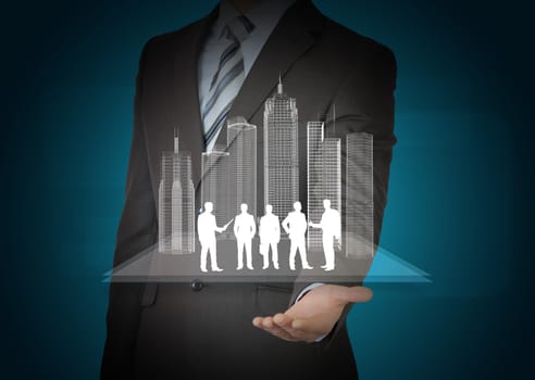 Model of city and business people silhouette in businessmans hands on abstract blue background