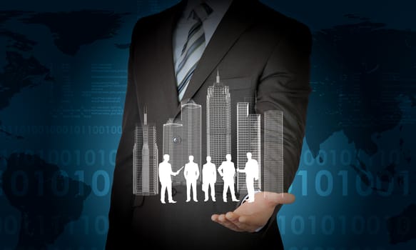 Model of city and business people silhouettes in businessmans hands on abstract blue background
