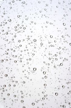 Drops of rain on the inclined window (glass). Shallow DOF.