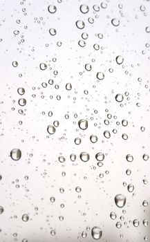 Drops of rain on the inclined window (glass). Shallow DOF.