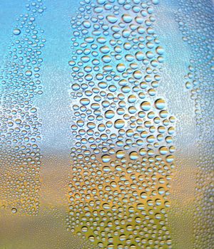 Drops of water on the crooked glass, shallow dof