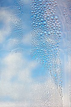 Drops of water on the crooked glass, shallow dof