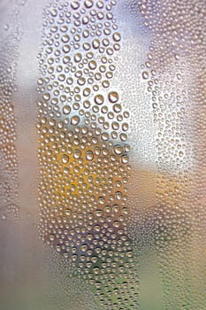 Drops of water on the crooked glass, shallow dof