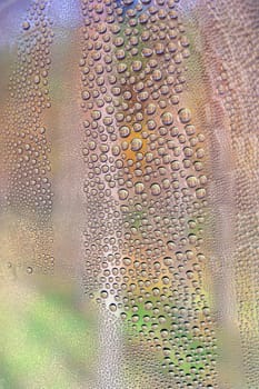 Drops of water on the crooked glass, shallow dof