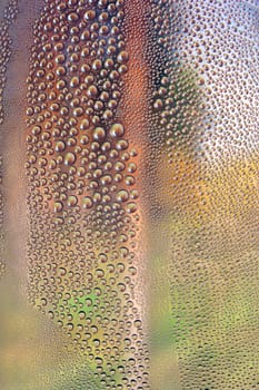 Drops of water on the crooked glass, shallow dof