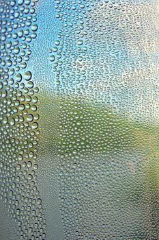 Drops of water on the crooked glass, shallow dof