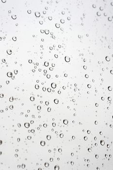 Drops of rain on the inclined window, shallow dof