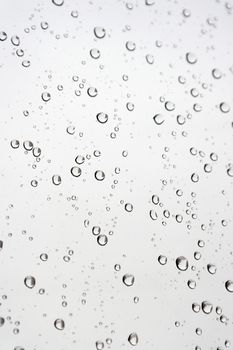 Drops of rain on the inclined window, shallow dof