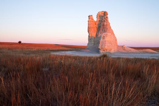 Castle Rock in Kansas is a dramatic 70-foot spire created by erosion of Smoky Hills chalk beds.