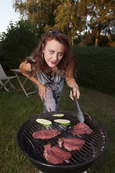woman in a retro dress on the bbq