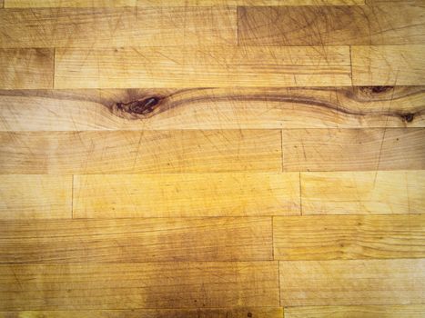Scratched wooden surface with knots, yellow, usable as background, decoration or structure illustration