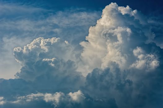 Large fluffy cloud relief details on blue sky