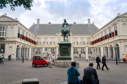 The Hague, Netherlands - May 8, 2015: People visit Noordeinde Palace, the Hague, Netherlands. Hague is the capital of the province South Netherlands.