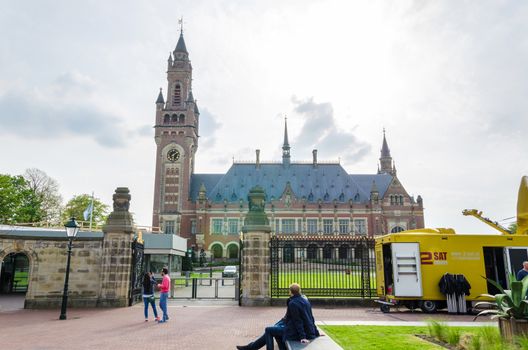 The Hague, Netherlands - May 8, 2015: Reporters at The Peace Palace in The Hague, Netherlands. It is often called the seat of international law because it houses the International Court of Justice.