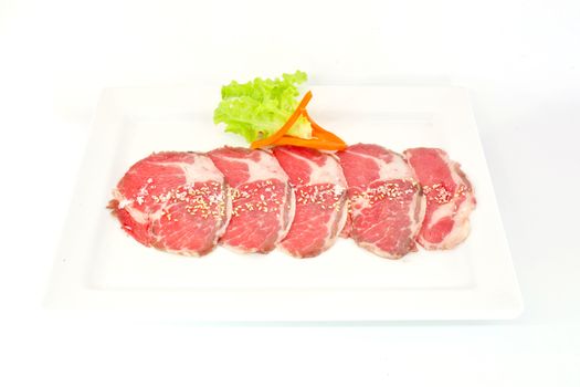 High grade sliced Hida wagyu beef isolated on white background