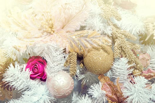 White christmas tree with christmas baubles.