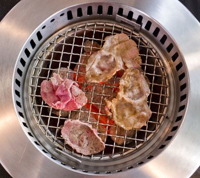 slide beef on the grill in japanese restaurant.