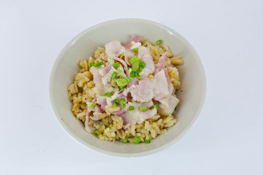 garlic fried rice with ham sliced and vegetable on top