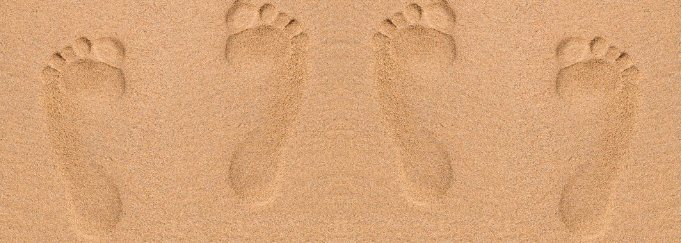 Footprints in sand at the Beach