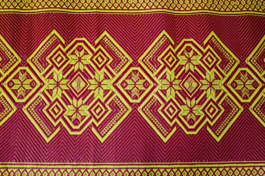 fabric texture red brown, terracotta. Painting on silk cloth. Thai painting pattern of golden brown silk cloth full frame.