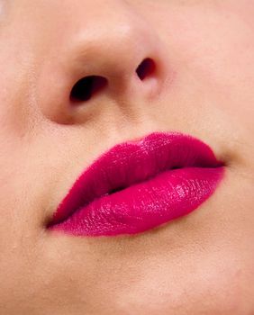 Female lips close up. Pink color