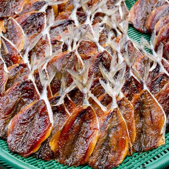 Dried fishes in the green basket