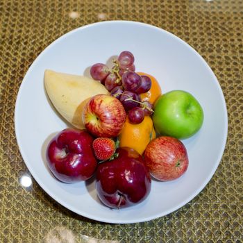 Mix fresh fruits in white dish