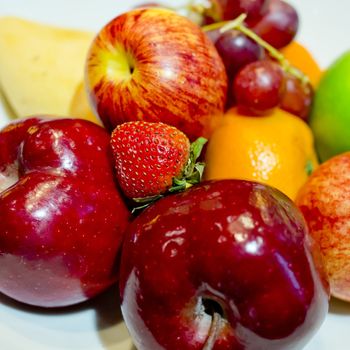 Mix fresh fruits in white dish