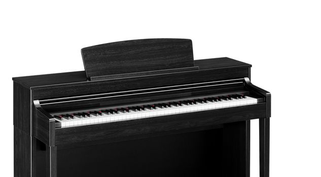 Real black grand piano isolated on white
