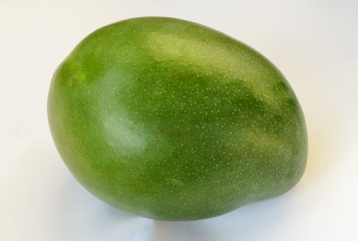 green mango fruit over white background