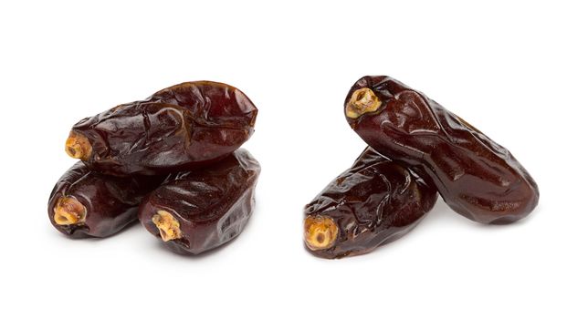 Fresh dates over white background