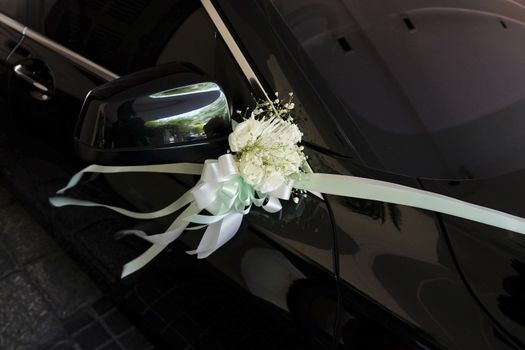 Flower bouquet on a wedding car