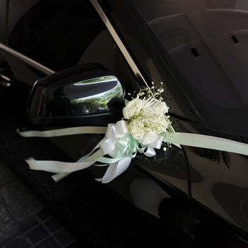 Flower bouquet on a wedding car