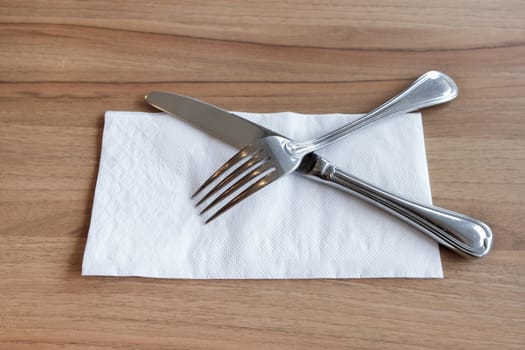 Fork and Knife Cutlery on white tissue