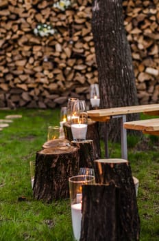 wedding decor, candles on the cut stumps