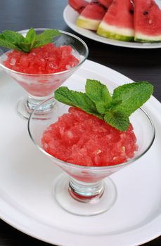 Refreshing watermelon granita with mint on a table
