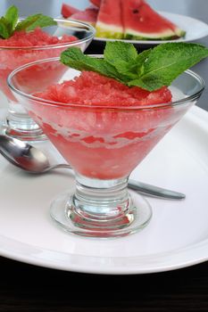Refreshing watermelon granita with mint on a table