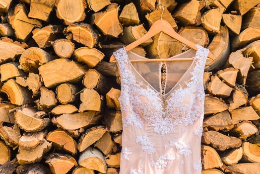 wedding dress on the tree on wood background