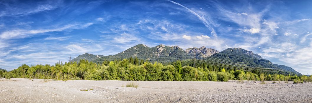 Banks of the River Isar in Bavaria, Germany with a view to the Karwendel mountains