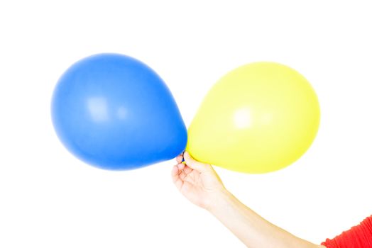 Hand holding balloons isolated on white background