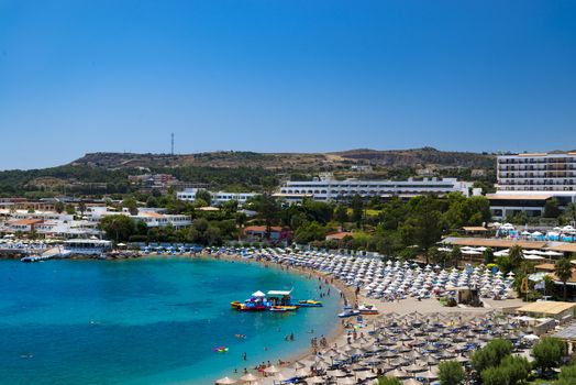 The hotels of Kallithea, Rhodes, flank a sheltered bay