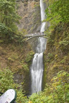 People enjoy the water at Multnomah Falls in Oregon.