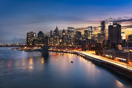 New York City - beautiful sunrise over manhattan with manhattan and brooklyn bridge USA