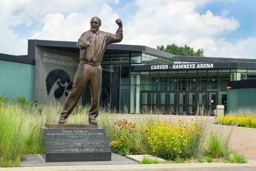 IOWA CITY, IA/USA - AUGUST 7, 2015: Dan Gable head wrestling coach statue at the University of Iowa. The University of Iowa is a flagship public research university.