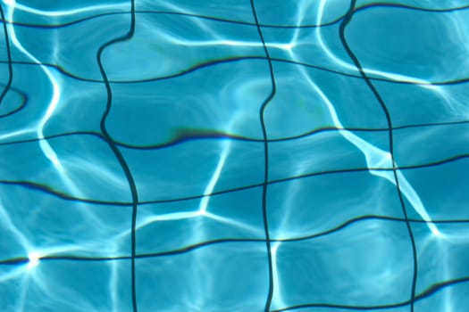 Blue water of a pool in greece in the sumer