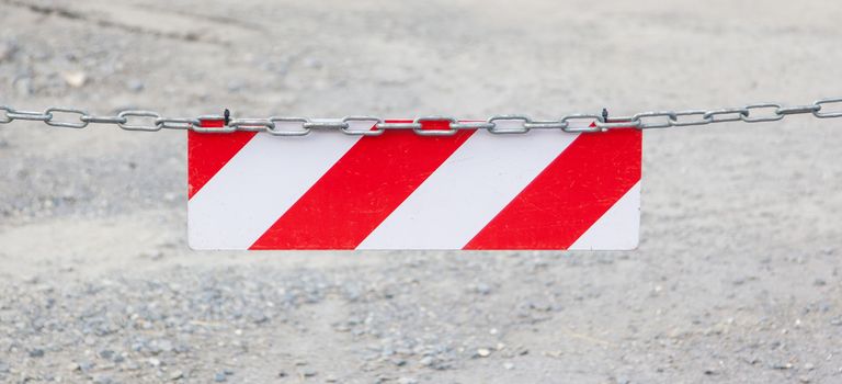 Red forbidden access sign, selective focus on sign